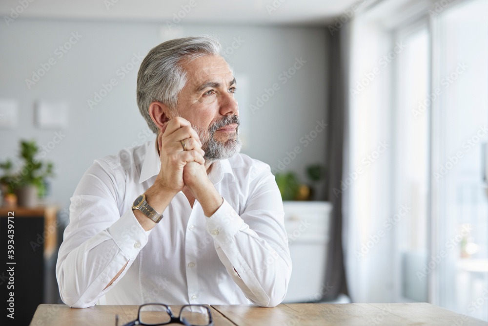 Portrait Of Pensive Mature Man At Home Stock Photo Adobe Stock