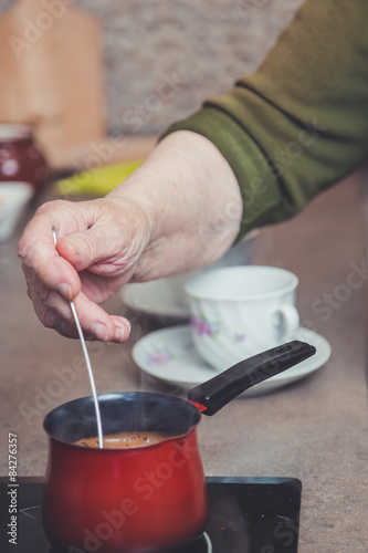 Older lady making coffee