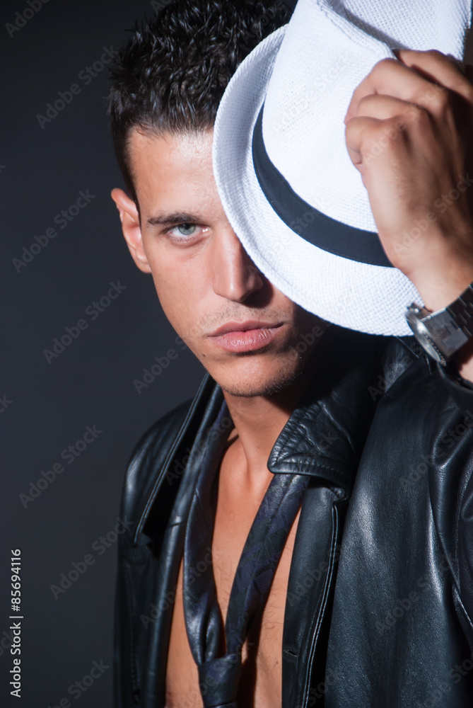 Fashionable Topless Male With White Fedora Hat Leather Jacket And Tie