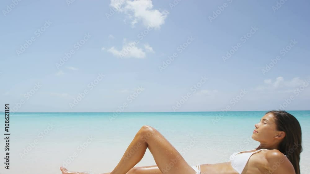 Suntan Woman Lying Down Relaxing Getting A Bikini Sun Tan On Caribbean