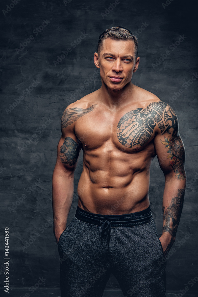 Muscular Man Fitness Model With Tattoo On His Chest Stock Photo