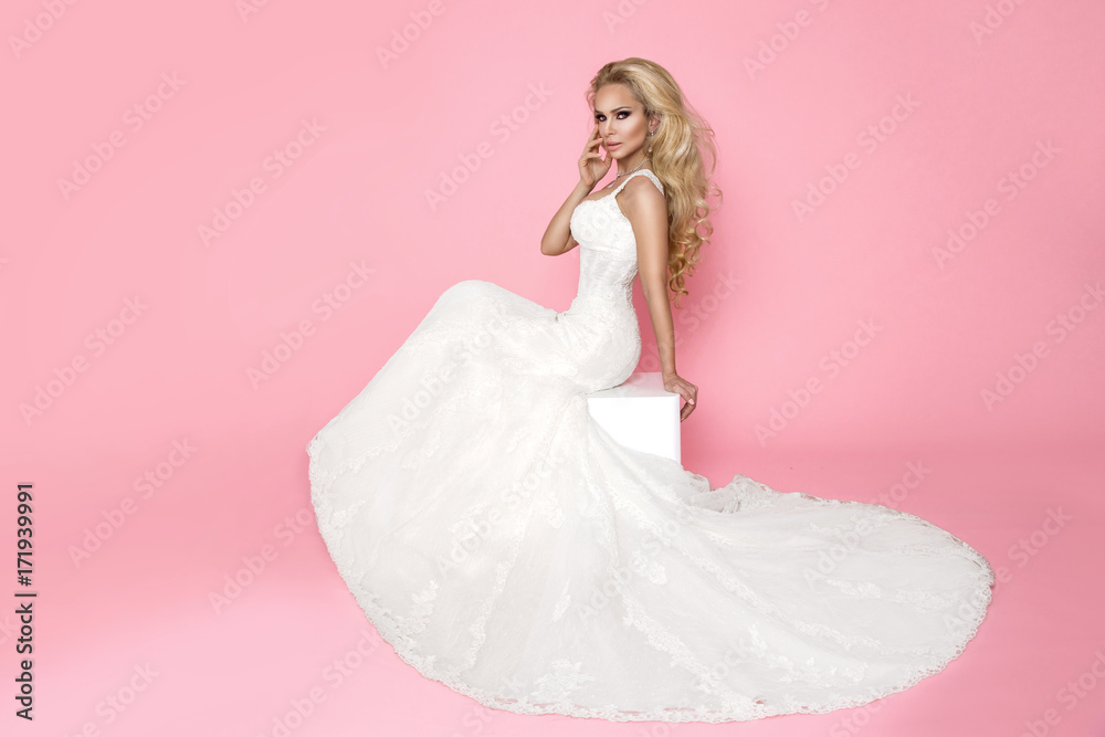 Beautiful Blonde Female Model In A Pink Wedding Dress On A Pink Background Stock Photo Adobe Stock
