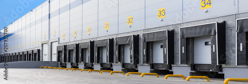 Entrance ramps of a large distribution warehouse with gates for loading goods