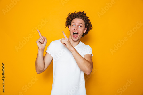 Portrait of an excited curly haired man