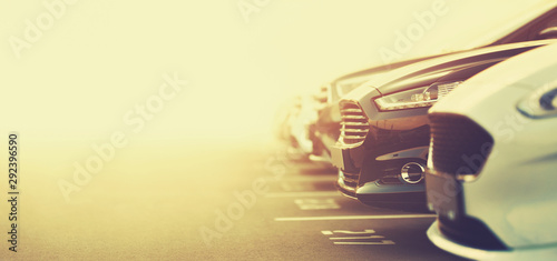 luxury cars on dealership parking in selective focus