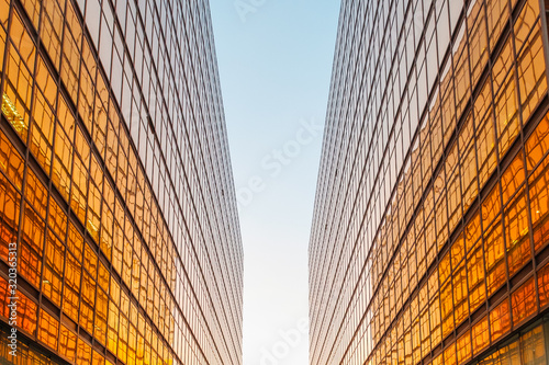 golden office building facade and blue sky