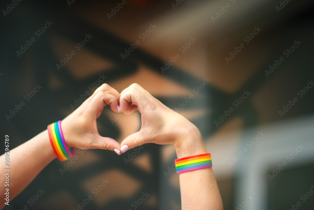 Pride Concept Hand Making A Heart Sign With Gay Pride Lgbt Rainbow Flag Wristband Stock Photo