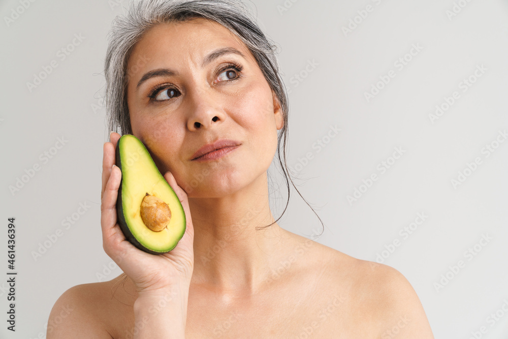 Mature Shirtless Woman With Grey Hair Showing Avocado Foto De Stock