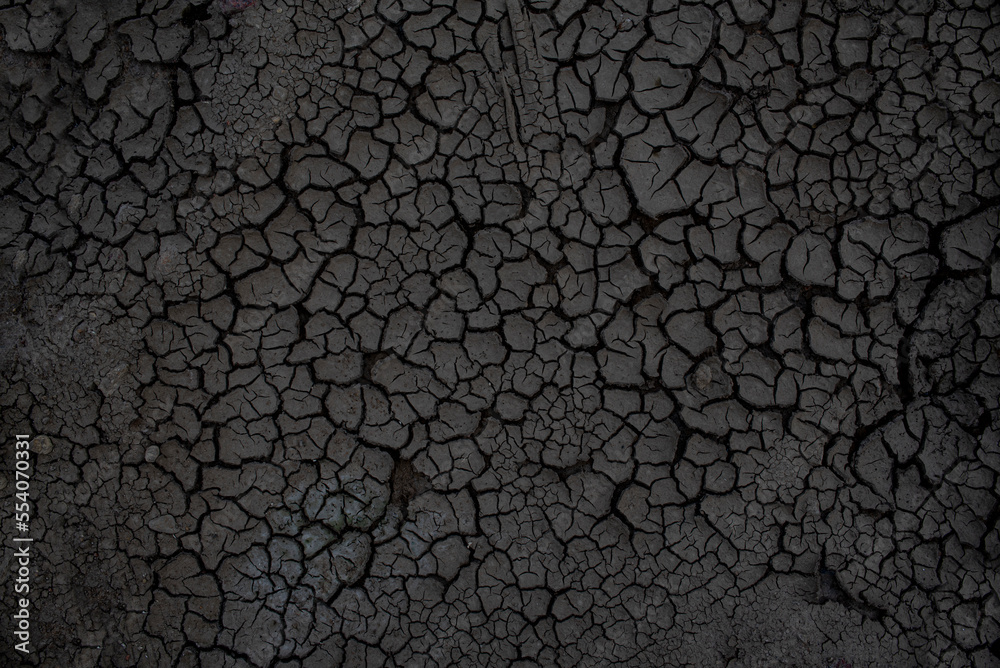 Gray Dried And Cracked Ground Earth Background Close Up Of Dry Fissure