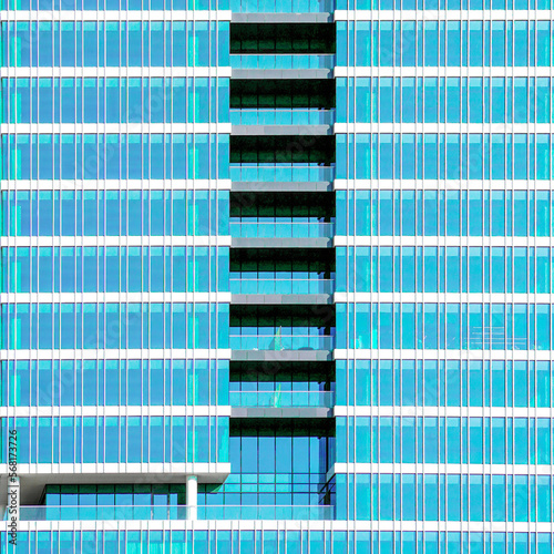 Glass blue windows of facade modern city business building skyscraper. Building window texture  