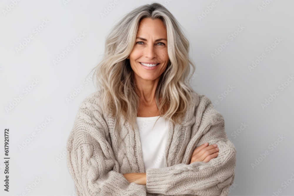 Portrait Of Beautiful Mature Woman With Crossed Arms Isolated On Grey Background Stock