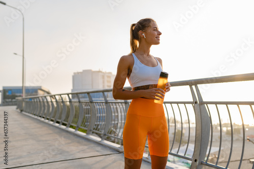 pretty young smiling woman doing sports in the morning in stylish sport outfit sportswear, skinny strong body, healthy fit lifestyle