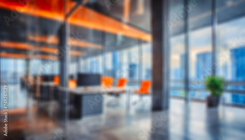 A blurry image of a large glass-walled office with several chairs and a potted plant. The office looks like a corridor or lobby, and chairs are placed along the walls, glass walls is a busy city again