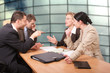 © endostock - business negotiations - 2 men 2 women