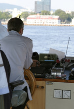 Ferry Captain Sitting At The Wheel