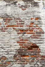Aged Red Brick Wall With Remaining Plaster Spots