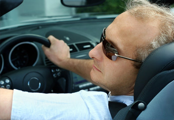 mature man in the car