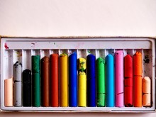 a rainbow of colorful, wear worn oil pastels