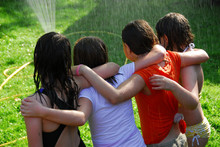 Group Of Girls And Sprinkler