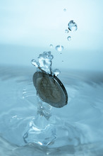 Coin Falling In Water
