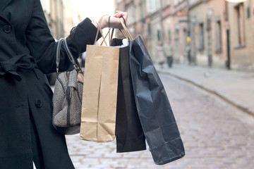 holding shopping bags