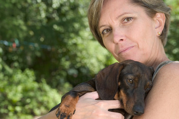 woman and puppy