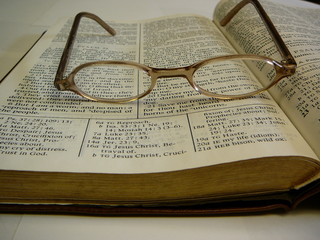 Wall Mural - bible with eye glasses
