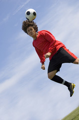 soccer football player making header