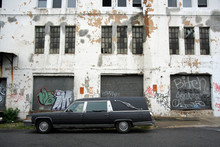 Hearse And Old Warehouse