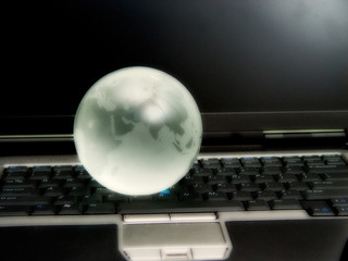 laptop keyboard globe and trackpad