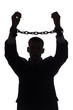 silhouette of man with chains