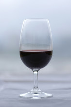 Glass Of Port Wine Against Muted Green/grey