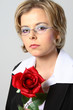 blond woman with glasses and red rose