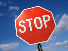 Stop Sign Against Blue Sky