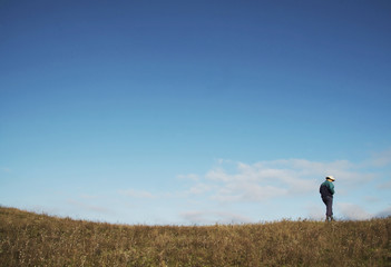 Wall Mural - alone men on the grassland