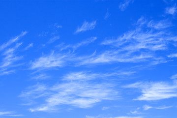 blue sky with delicate clouds