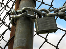 Lock, Chains And Chain Link Fence