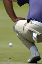 Golfer Lines Up Putt