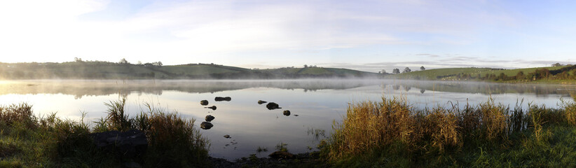 misty autumn sunrise on an irish lake