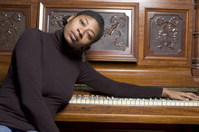 Woman In Front Of Old Piano
