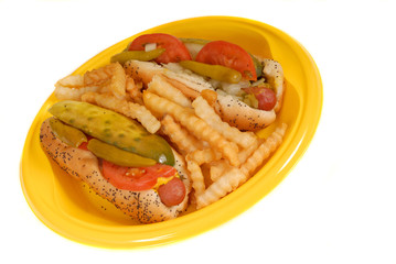 full view of chicago style hot dogs with french fries