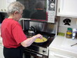 senior female cooking