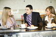 © Tomasz Trojanowski - group of business people at coffee break