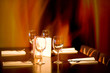 restaurant table for four with flame background