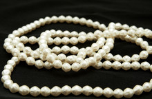 White Real Pearls On Black Background