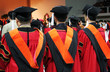 three asian university graduates