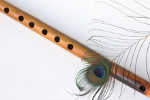 Asian Bamboo Flute And Peacock Feather