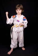 boy wearing martial arts outfit