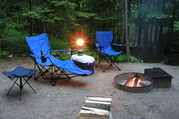 sitting by the fire at a campsite