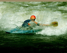 Kayaker Working A Rapid